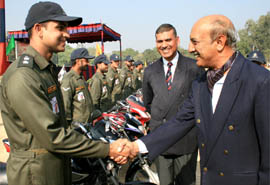 Maj Gen D.C. Katoch shakes hand with Capt Vishal Patil after 'Wheels and Waves' rally arrived in Bathinda on Friday.