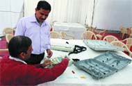 Election officers check EVMs at Ludlo Castle booth in 