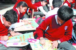 Schoolchildren participate in a painting competition at Gandhi Memorial, New Delhi