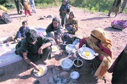A Bakerwal family having food at Arnas on the Mahore-Reasi road.