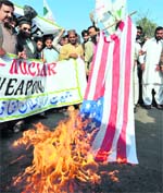 Pakistani demonstrators burn a US flag during a protest in Lahore on Friday against US missile strikes in Pakistani tribal areas.  AFP