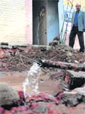 Water oozes out of a damaged water pipe in Sector 24
