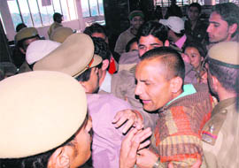 Cops trying to push back students of Himachal Pradesh University during their protest in front of DSW office in Shimla on Saturday.
