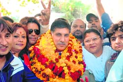 Pardeep Bali, NC candidate from Jammu East, with his supporters on way to the DC office for filing nomination for the Assembly elections in Jammu on Saturday. 