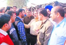 Dyers and BJP councillors argue with PSEB officials in Ludhiana on Saturday. 