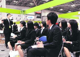 Students attend a job matching meeting in Tokyo on Sunday. Some 80,000 students are expected to visit the two-day event to seek jobs