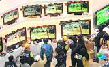People are seen at the computer show being held in the Taipei World Trade Centre on Monday.