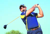 Harsimran Singh Gill sees the ball soaring as he goes for a long drive on Panchkula Golf Club greens on Sunday. 