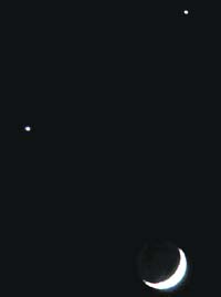 Smiley in sky: The crescent Moon, Venus and Jupiter come together to present a celestial spectacle in the sky on Monday night.