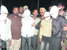 The four youths allegedly involved in the kidnapping of Japjit Singh in police custody at the Sector 39 police station in Chandigarh on Monday. 