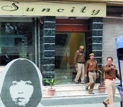 Delhi cops check Suncity Hotel in Paharganj after a Japanese woman (inset) was found dead