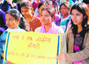 Participants at an awareness function held in Dehradun on the occasion of World AIDS Day on Monday.