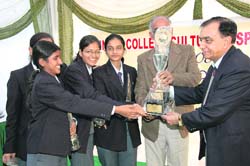 Students receive a trophy from V.K. Tiwari, vice-chancellor, Uttarakhand Technical University, at the prize distribution ceremony in Dehradun on Monday.