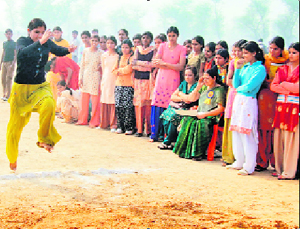 A student participates in an athletic meet in Jhajjar.