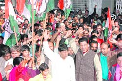 Congress workers protest against the demolition of Lohianagar slum colony at the office of the district magistrate, Dehradun, on Tuesday. 