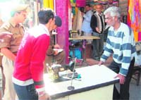 District authorities remove encroachments at Dispensary Road in Dehradun on Tuesday. 