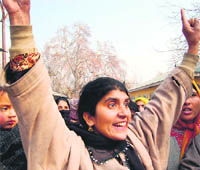 Kashmiri women protest in Srinagar on Tuesday against the Army for injuring a youth in shooting at Budgam on Monday.