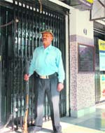 A private security guard outside a bank in Jammu
