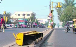 An outer cover of a traffic light that has been lying on a divider at Pakhowal road. It seems that the MC authorities are concerned only about installation and not maintenance