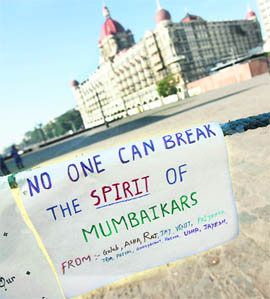 Posters displayed near the Taj Mahal hotel in Mumbai on Tuesday.