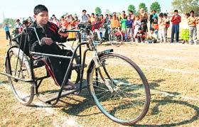 A disabled kid participates in a race in Mohali
