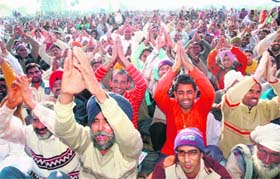 The Dera followers with folded hands at the Sector 25 rally ground