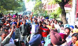Shopkeepers protest at Rama Mandi in Jalandhar on Wednesday.