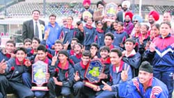 Winners pose with their trophy at Guru Nanak Stadium in Ludhiana