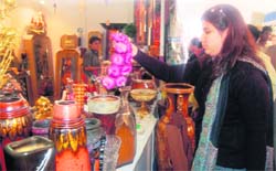 A woman examines artefacts at trade fair PITEX-08 being organised by PHD Chamber of Commerce in Amritsar