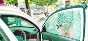 A broken windowpane of the car in Chandigarh on Thursday.