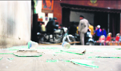 A broken windowpane of the auditorium of DAV College.