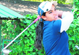 Gauri Monga sees the ball as she completes her swing in the 16th Punjab Open Ladies Amateur Golf Championship at Chandigarh Golf Club on Thursday.