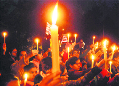 Volunteers of Saarthi, an NGO, hold a candlelight procession against the Mumbai terror attacks in Karnal on Thursday evening.
