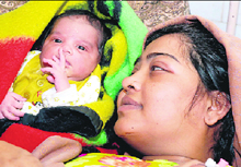 A baby girl, who was abducted from a Karnal hospital on Thursday, with her mother after being recovered by the police.