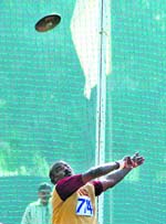 A participant in action during the disc throw competition on the Panjab University campus on Friday. 
