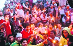 Residents pay homage to Mumbai terrorist attack victims at Major Sandeep Shankla Memorial in Sector 2, Panchkula, on Friday evening.
