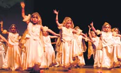 Tiny tots perform in Globe Trotting at Manav Mangal Smart School, Phase X, Mohali, on Friday. 