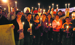 A peace march organised by residents in memory of Mumbai attack victims at Sarabha Nagar in Ludhiana.