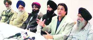 Mangal Dhillon addressing a press conference in Jagraon on Friday.