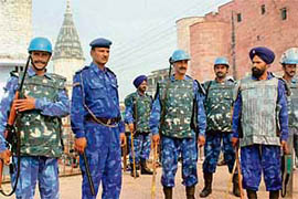 Security personnel stand guard in Ayodhya on the eve of the anniversary of the demolition of the Babri Masjid on Friday.