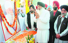 Chief Minister Parkash Singh Badal pays homage to Sant Baba Fateh Singh at his native village Badiala in Bathinda on Friday.
