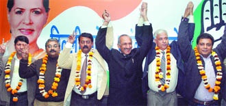 DPCC president J.P. Agarwal with DU poll panel candidates during a press conference in New Delhi on Friday.