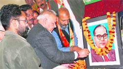 Senior BJP leader Chaman Lal Gupta pays tribute to Dr Bhim Rao Ambedkar on his 52nd death anniversary in Jammu