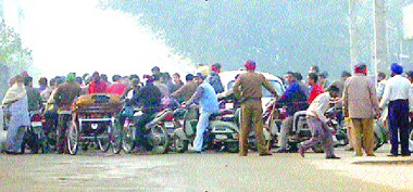 Cops divert traffic during the visit of SAD chief Sukhbir Singh Badal to the city.