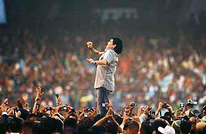 Diego Maradona, Argentinas national team coach and former football superstar, seen gesturing as he attends a felicitation programme at Salt Lake Stadium in Kolkata on Saturday.