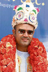 Virender Sehwag poses for a photograph during his visit to a school in Chennai on Saturday.