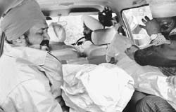 A grieving father, Dalbir, holds the body of his two daughters who were killed in a road accident in Mohali 