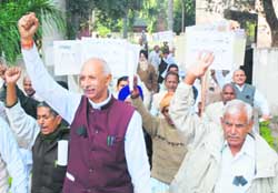 Ex-servicemen hold a protest in Karnal on Sunday. 