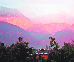 Sun sets on the Dhauladhar ranges in Kangra district.
