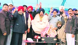 BSP activists felicitate state president of the party, Avtar Singh Karimpuri, for being elected to the Rajya Sabha at a party rally in Ludhiana